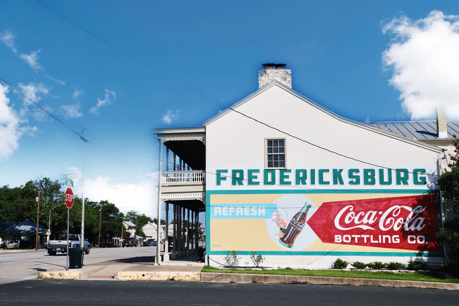 The historic Fredericksburg Coca-Cola mural painted on a white building downtown